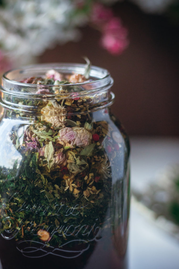 herbal tea steeping in jar close up